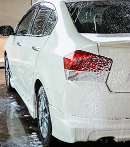 White Car Going Through A Car Wash